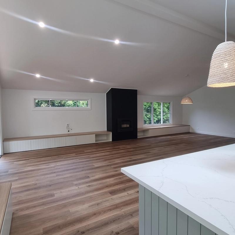 Living area with wood fireplace – Bensville renovation